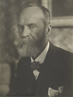 Photo of a bearded man with gray hair
