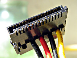 SATA Power Connector (This example is missing an orange 3.3 V wire running to the connector.)