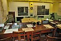 RAF Digby Operations Room with a sector clock displaying inward pointing triangles, typical of electrical models. This clock appears to show a key aperture below the dial and may be mechanical.