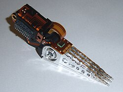 Head stack with an actuator coil on the left and read/write heads on the right