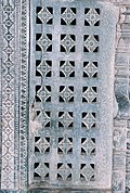 A pierced window screen brings light into the mandapa at Manikesvara Temple in Lakkundi, Lakkundi