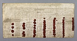 Large hand-written document, coloured yellow with age. There is a block of text at the top, and 59 signatures and red wax seals at the bottom.