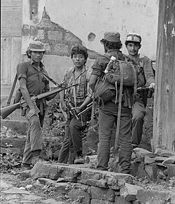 A black-and-white photograph of guerrilla combatants
