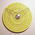 Pickett circular slide rule with two cursors. (4.25 in/10.9 cm width) Reverse has additional scale and one cursor.