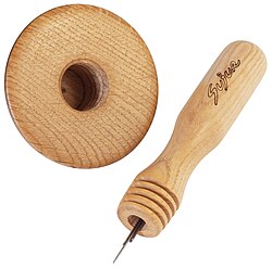 A darning mushroom with a built-in screw-on needlecase taken apart, so that the needles are partially visible